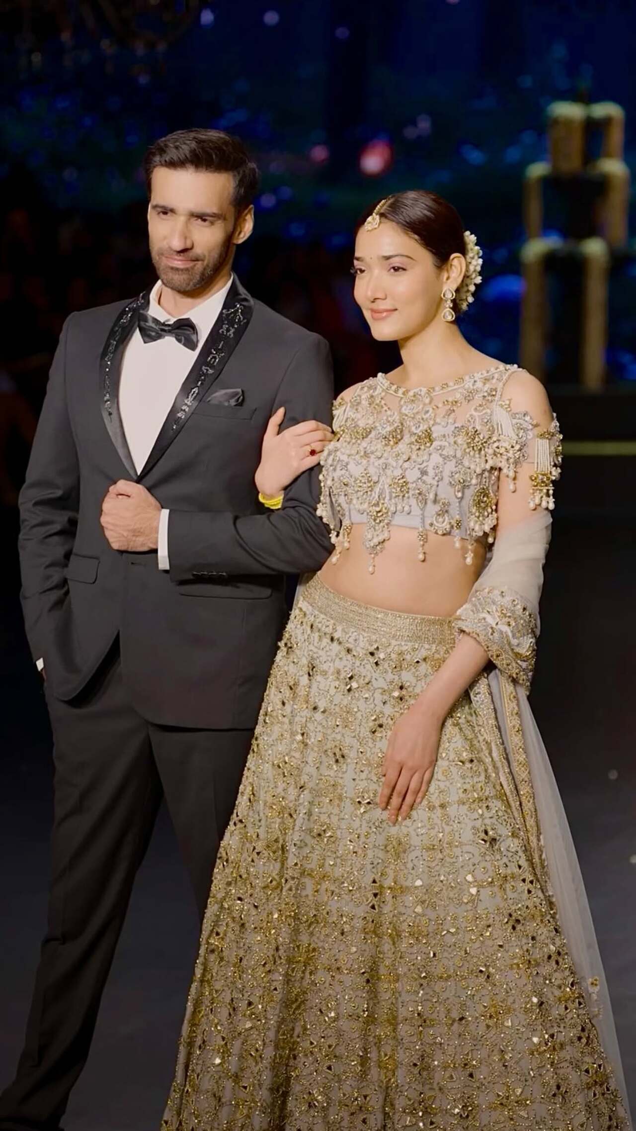 Medha Shankr looks breathtaking in this ornate, bridal-inspired embellished lehenga set in a sophisticated silver-grey hue, featuring intricate gold embroidery. She completes the regal aesthetic with classic gold jewelry.